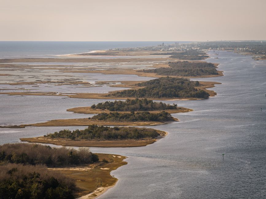 Breathtaking aerial view of the serene Carolina coastline with lush islands and calm waters.